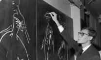 Yves Saint-Laurent Sketching On Chalkboard